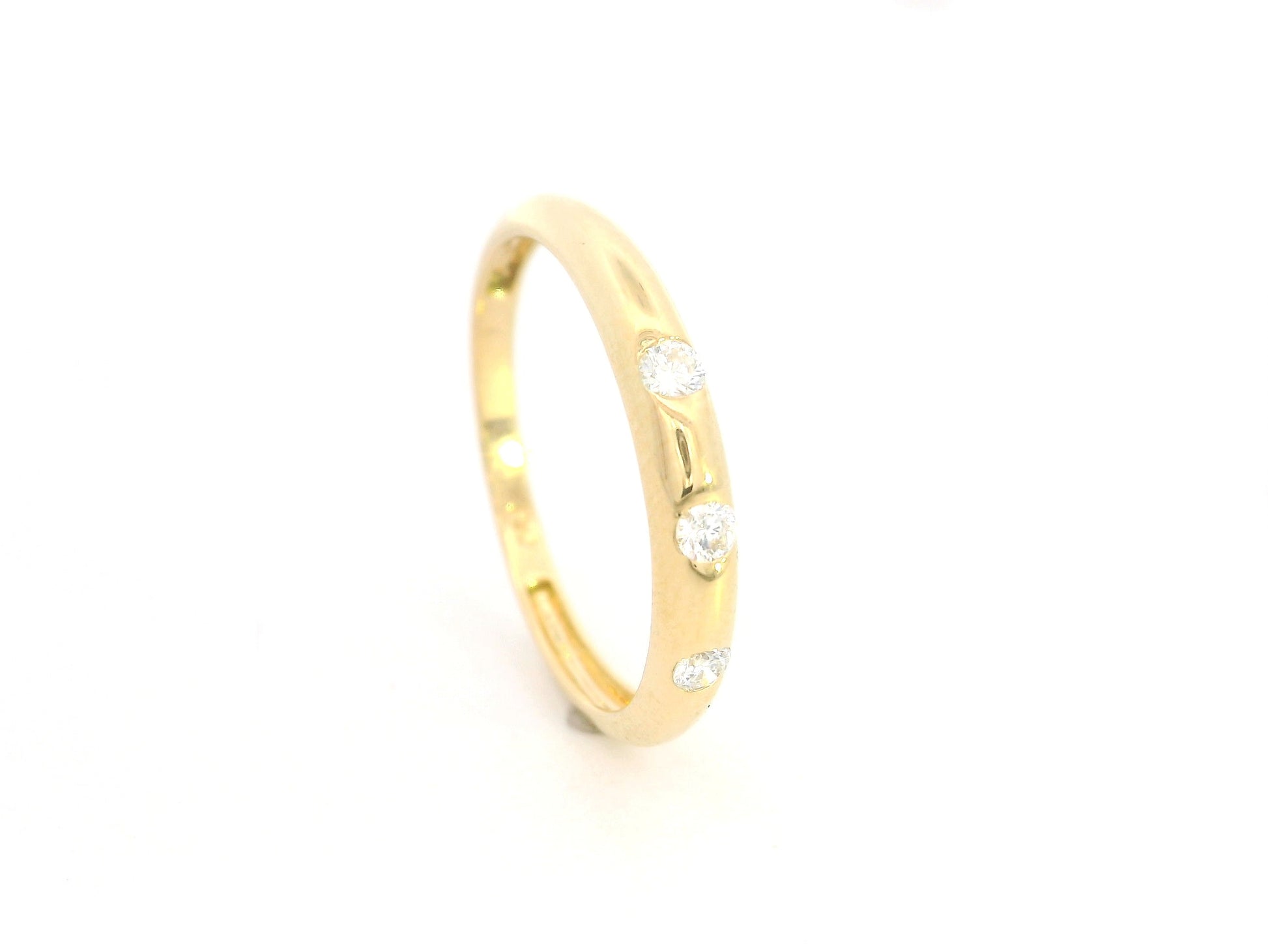 Minimal diamond band ring in 18K yellow gold with 0.13 carat diamonds