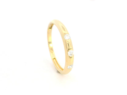 Minimal diamond band ring in 18K yellow gold with 0.13 carat diamonds