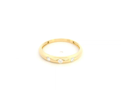 Minimal diamond band ring in 18K yellow gold with 0.13 carat diamonds