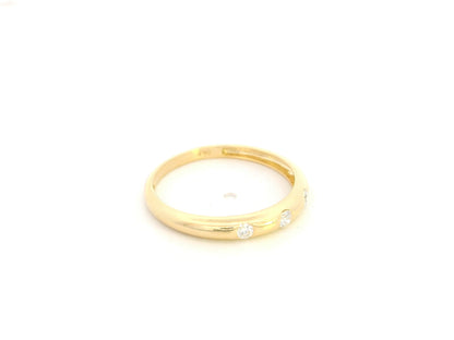 Minimal diamond band ring in 18K yellow gold with 0.13 carat diamonds