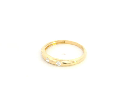 Minimal diamond band ring in 18K yellow gold with 0.13 carat diamonds