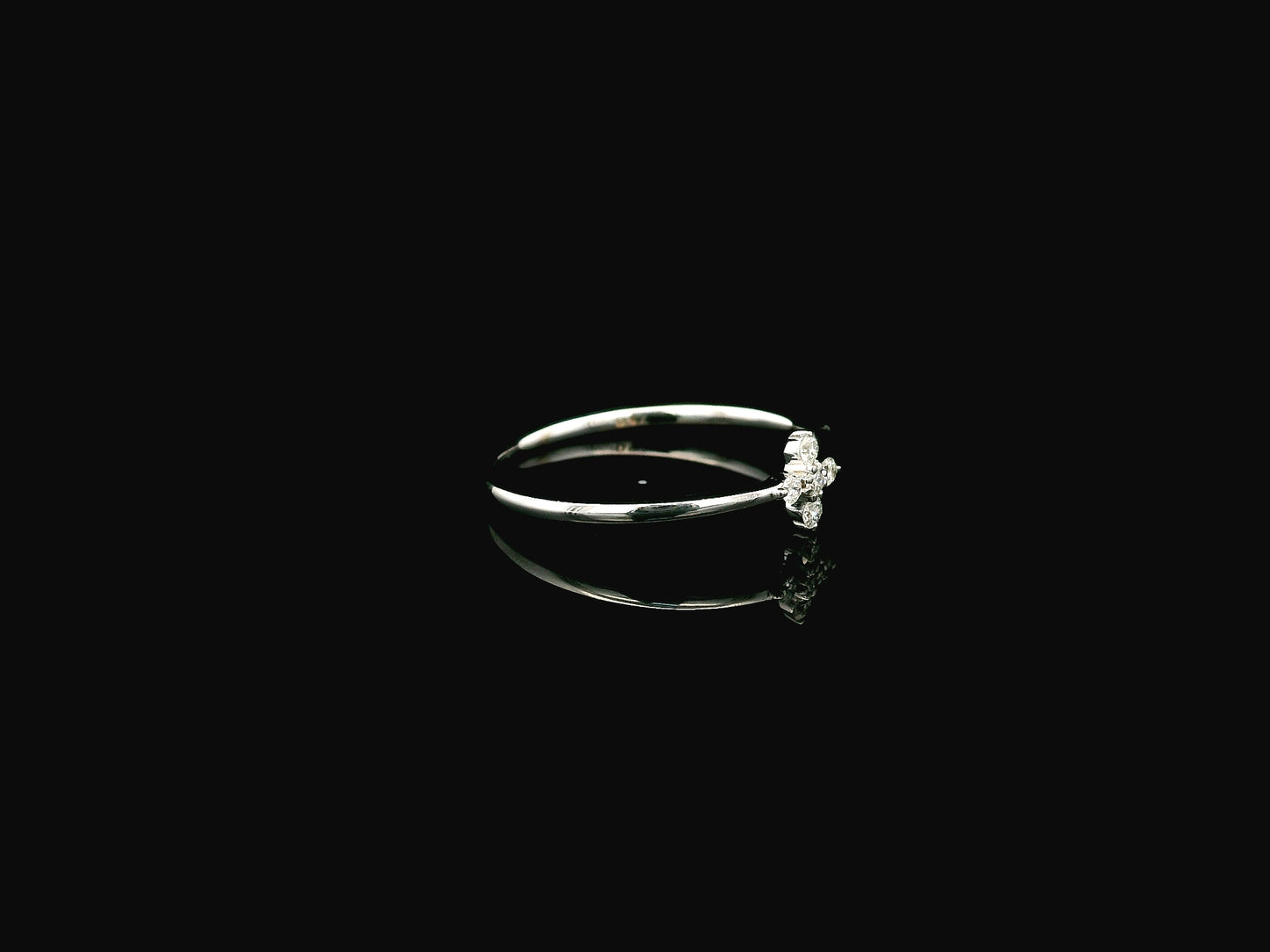 Dainty diamond floral cluster ring in 18K white gold minimal design