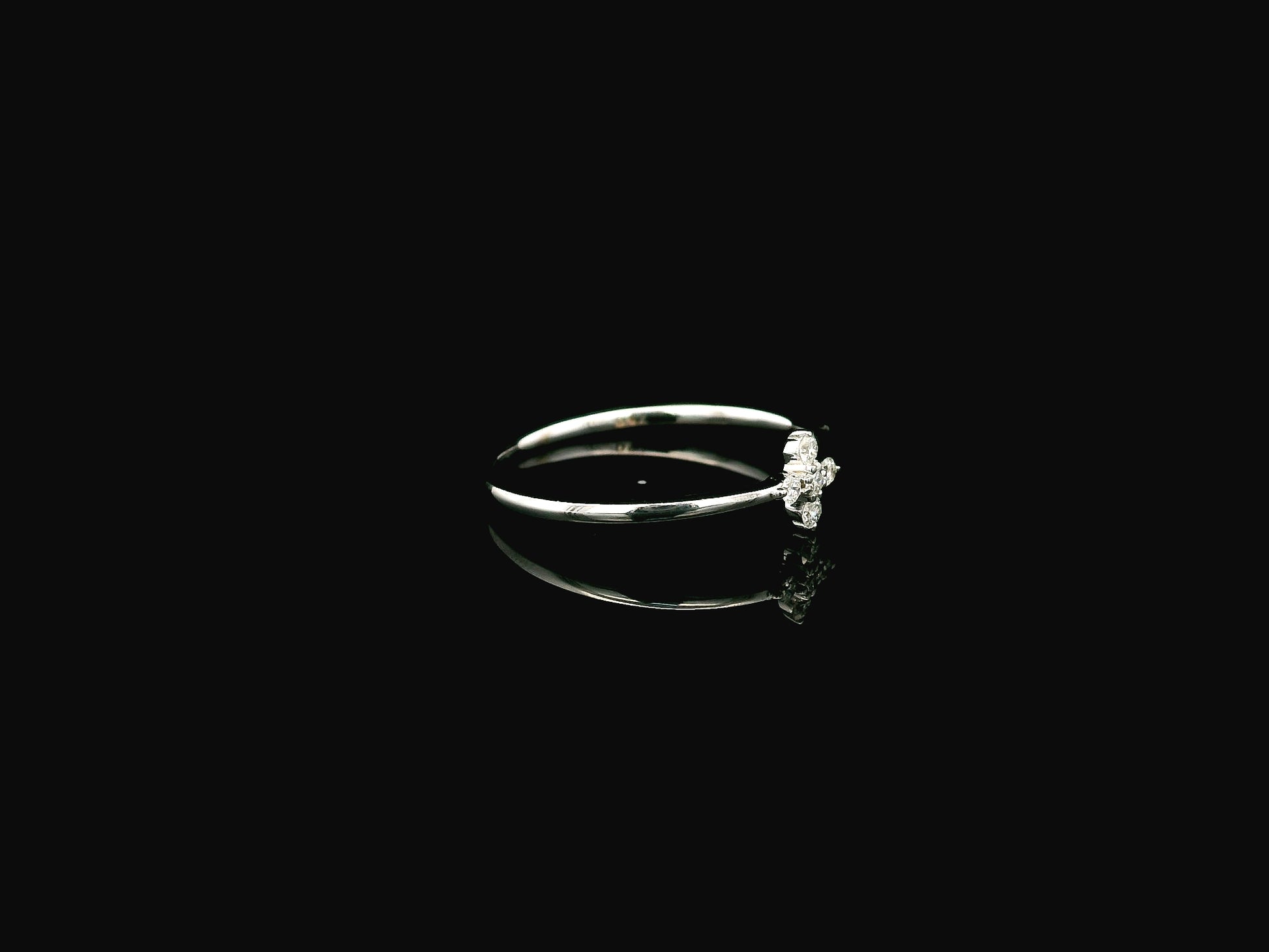 Dainty diamond floral cluster ring in 18K white gold minimal design