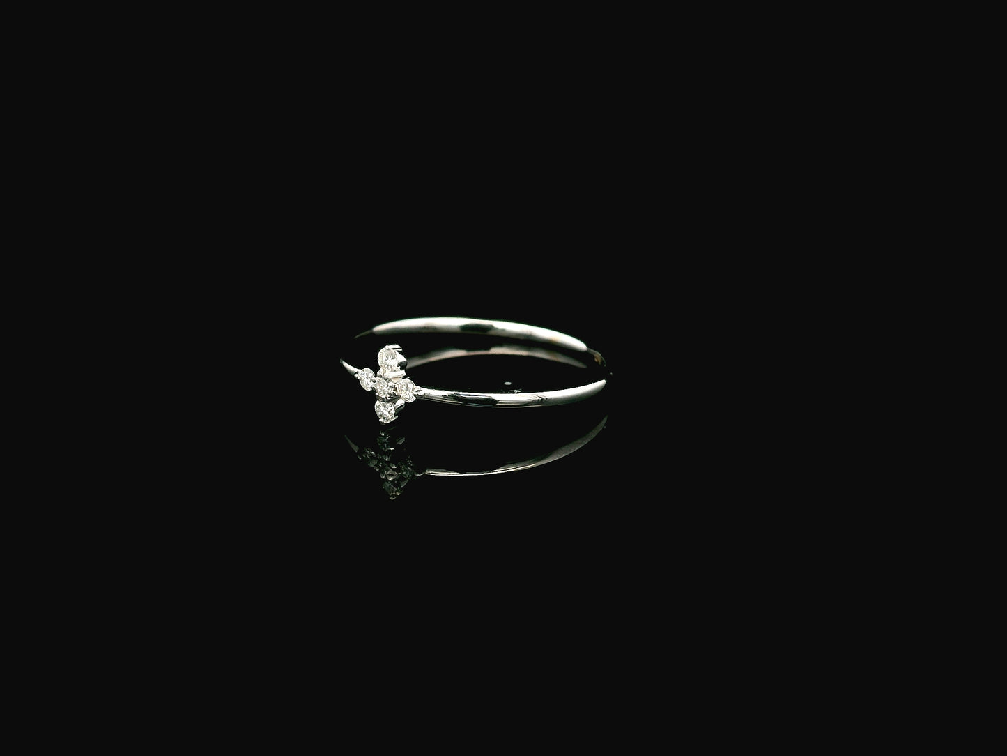 Dainty diamond floral cluster ring in 18K white gold minimal design