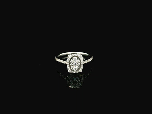 Diamond cluster halo ring in 18K white gold with oval diamond cluster and pavé band