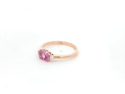 Oval pink sapphire ring with diamond accents in 18K rose gold by Emirates Diamonds