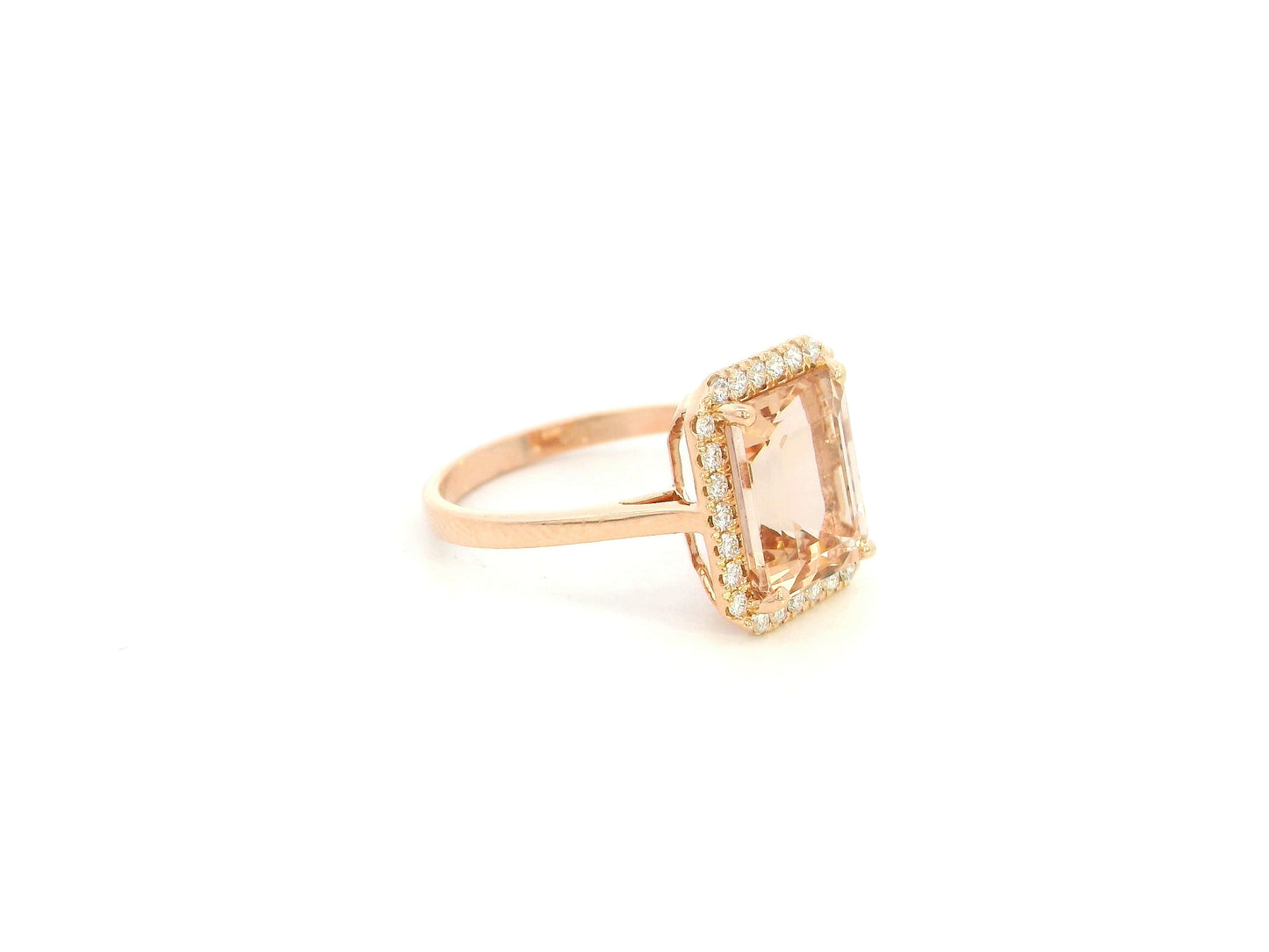 Emerald cut morganite halo ring with diamonds in 18K rose gold by Emirates Diamonds