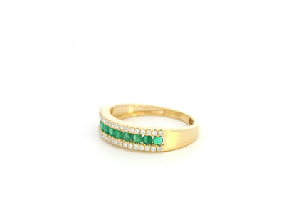 Emerald and diamond band ring in 18K yellow gold with channel set design by Emirates Diamonds