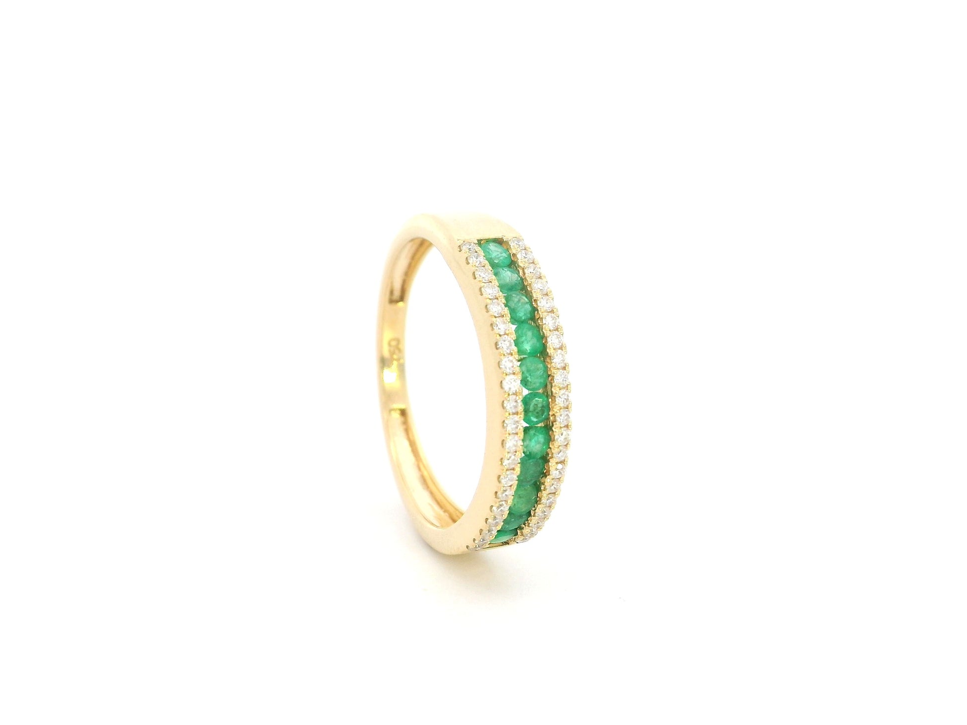 Emerald and diamond band ring in 18K yellow gold with channel set design by Emirates Diamonds
