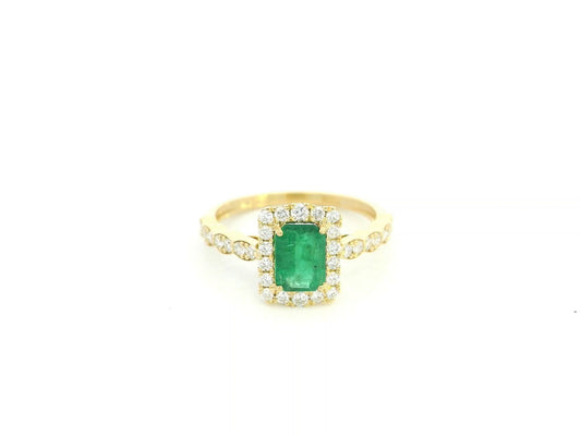 Emerald diamond halo ring in 18K yellow gold with emerald cut center and diamond band