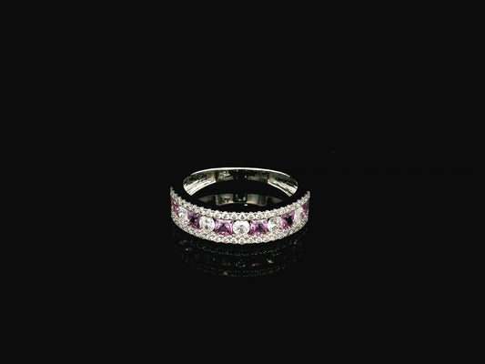 Pink sapphire diamond eternity band ring in 18K white gold with alternating princess cut sapphires