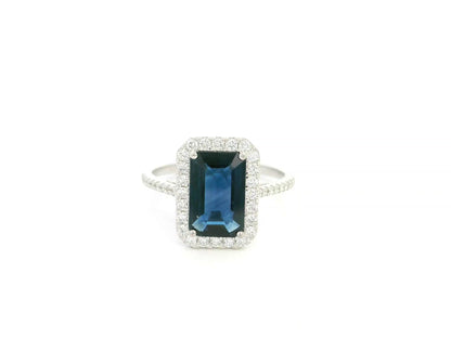 Emerald cut blue sapphire halo ring in 18K white gold with diamond accents Emirates Diamonds