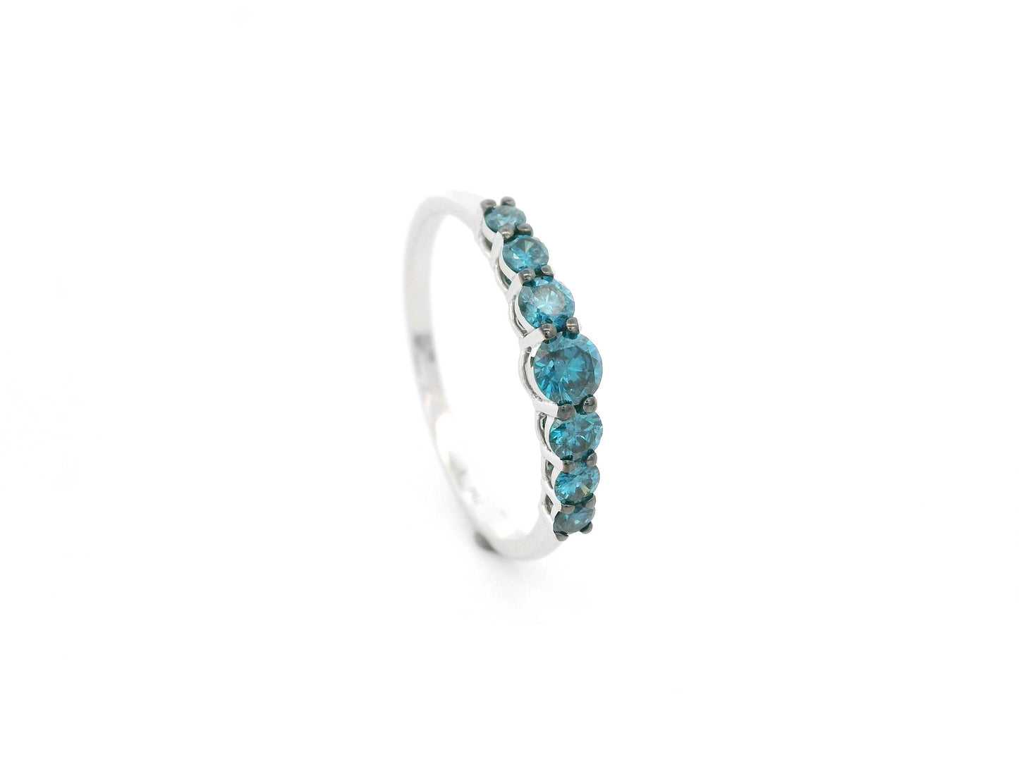 Shop a 0.50 carat blue diamond half eternity ring in 18K white gold. A bold, stackable luxury band by Emirates Diamonds.