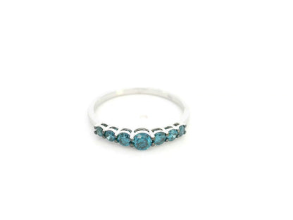 Shop a 0.50 carat blue diamond half eternity ring in 18K white gold. A bold, stackable luxury band by Emirates Diamonds.