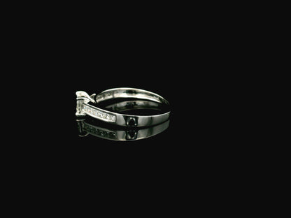 Princess cut diamond engagement ring in 18K white gold with channel set diamonds