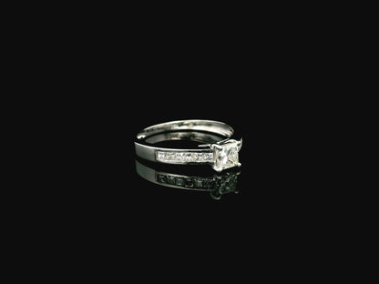 Princess cut diamond engagement ring in 18K white gold with channel set diamonds