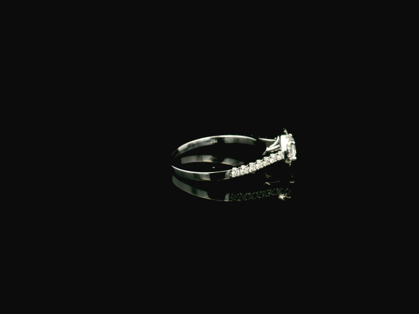 GIA certified round diamond halo engagement ring in 18K white gold with pavé diamond band