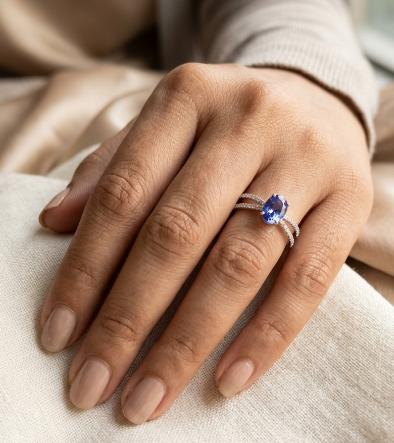 18K white gold tanzanite ring with 1.44 carat oval tanzanite and 0.35 carat diamond split band