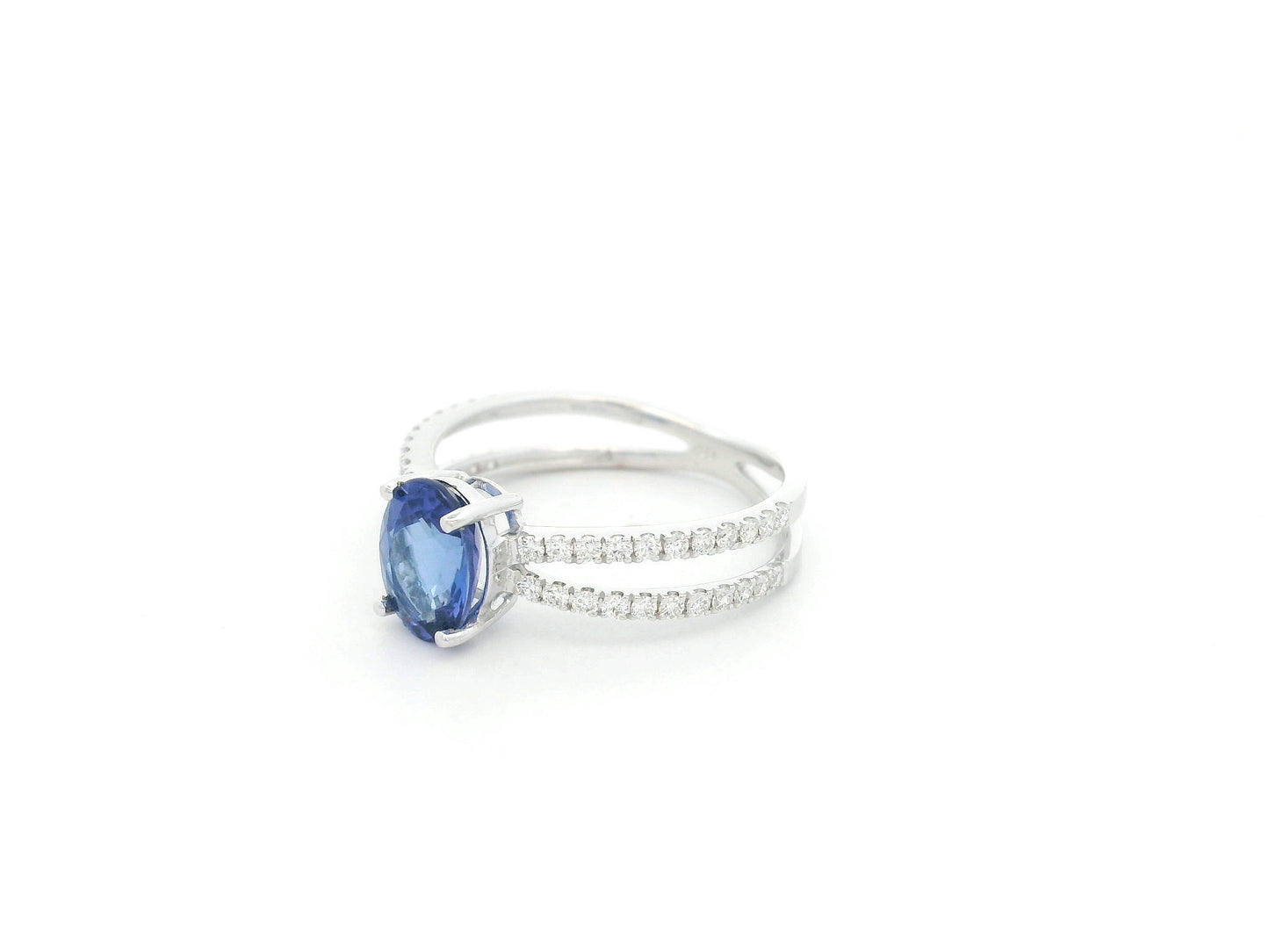 18K white gold tanzanite ring with 1.44 carat oval tanzanite and 0.35 carat diamond split band