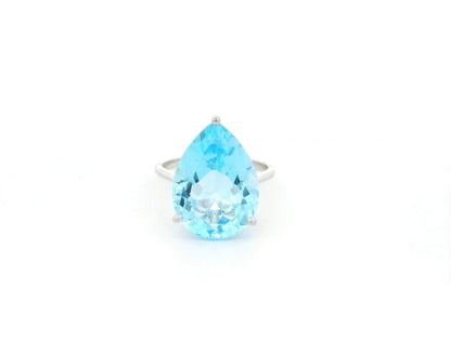 Large pear cut blue topaz solitaire ring in 18K white gold statement design