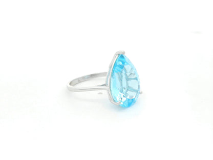Large pear cut blue topaz solitaire ring in 18K white gold statement design