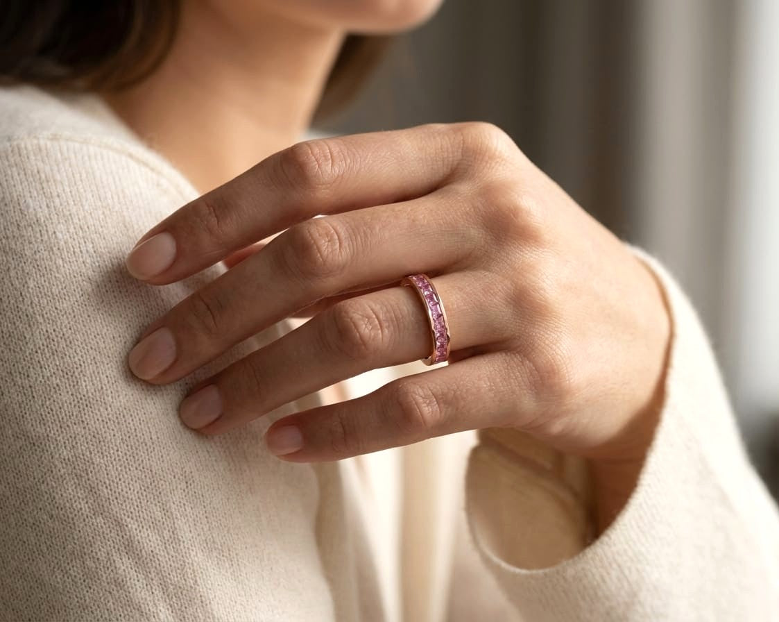 Pink sapphire channel set ring in 18K rose gold princess cut band