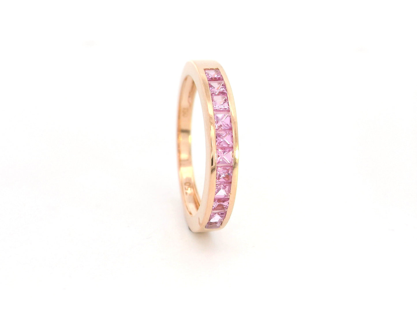 Pink sapphire channel set ring in 18K rose gold princess cut band