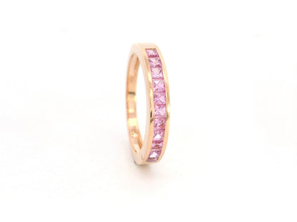 Pink sapphire channel set ring in 18K rose gold princess cut band