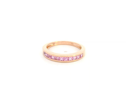 Pink sapphire channel set ring in 18K rose gold princess cut band