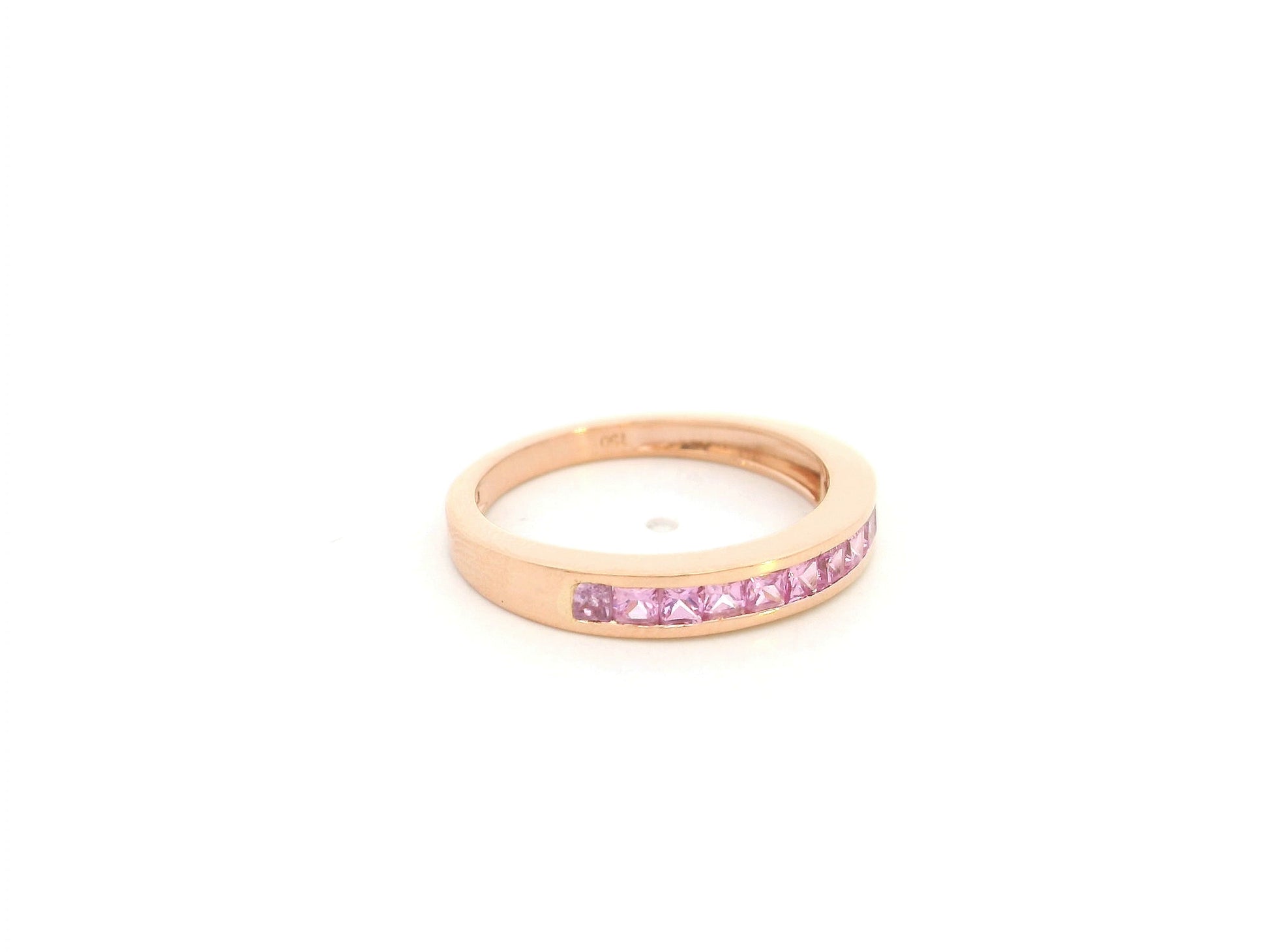 Pink sapphire channel set ring in 18K rose gold princess cut band