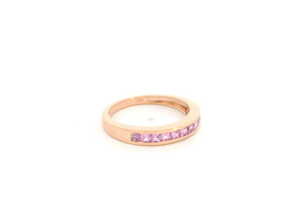 Pink sapphire channel set ring in 18K rose gold princess cut band