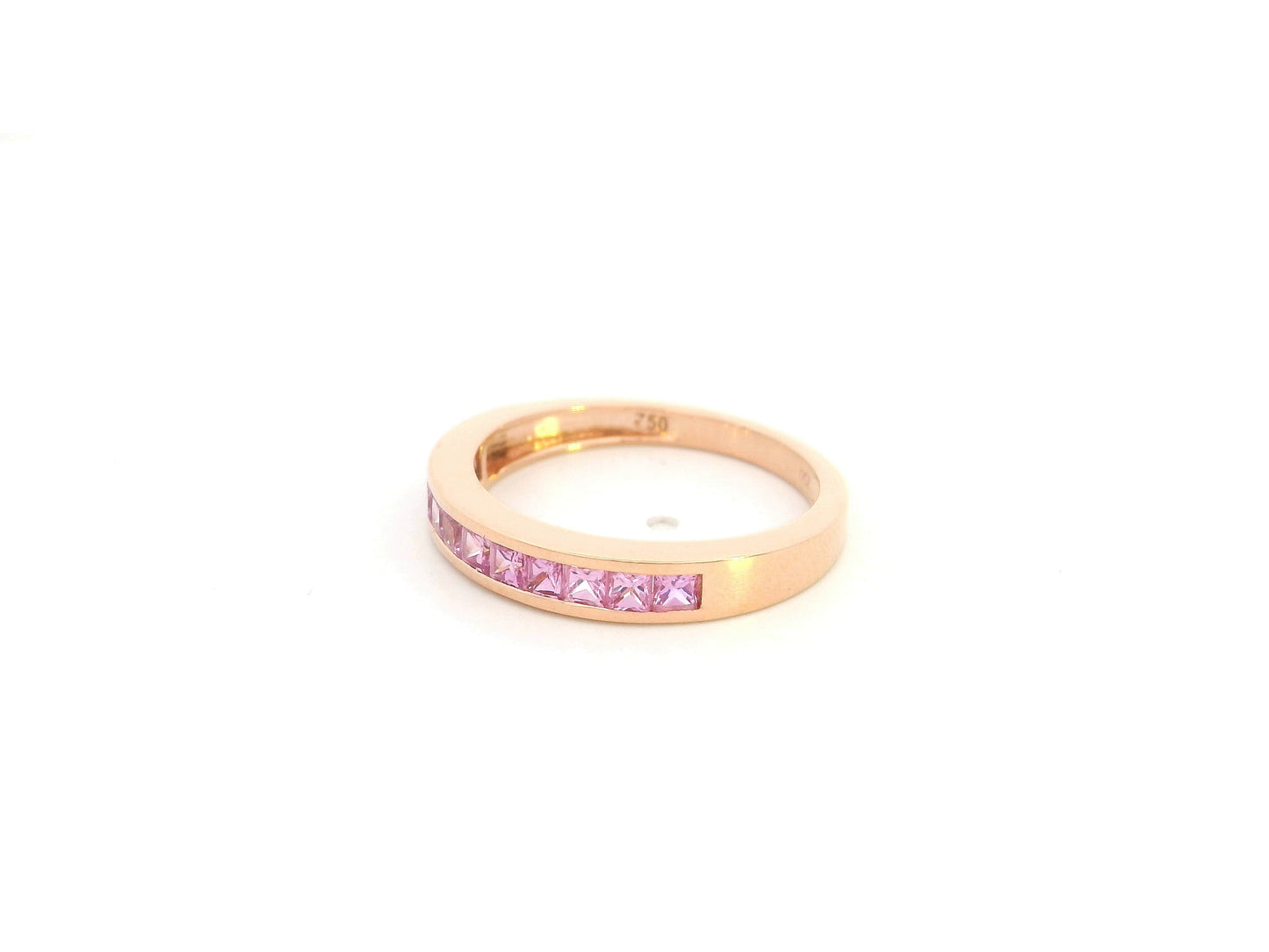 Pink sapphire channel set ring in 18K rose gold princess cut band