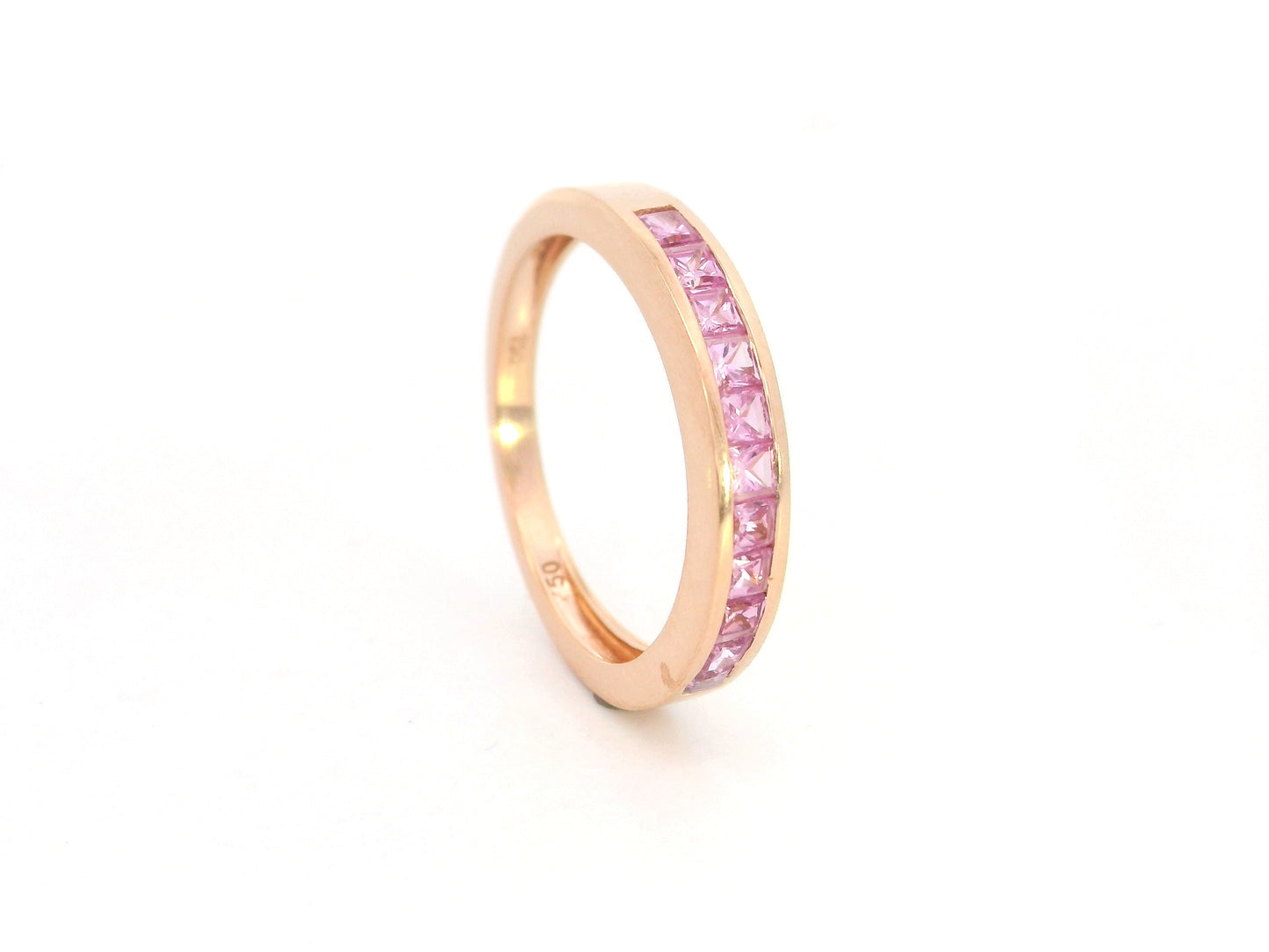 Pink sapphire channel set ring in 18K rose gold princess cut band