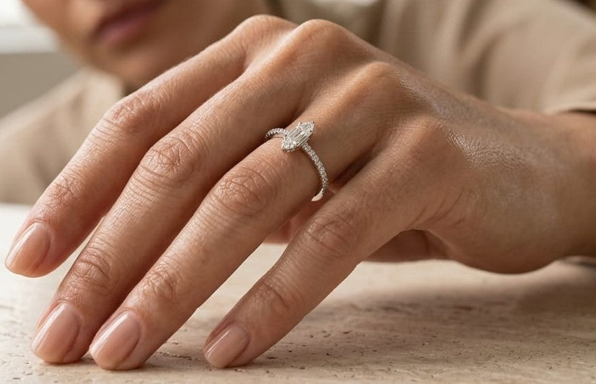 18K white gold marquise diamond ring featuring a combination of round brilliant and baguette diamonds with a total diamond weight of 0.28 carat.