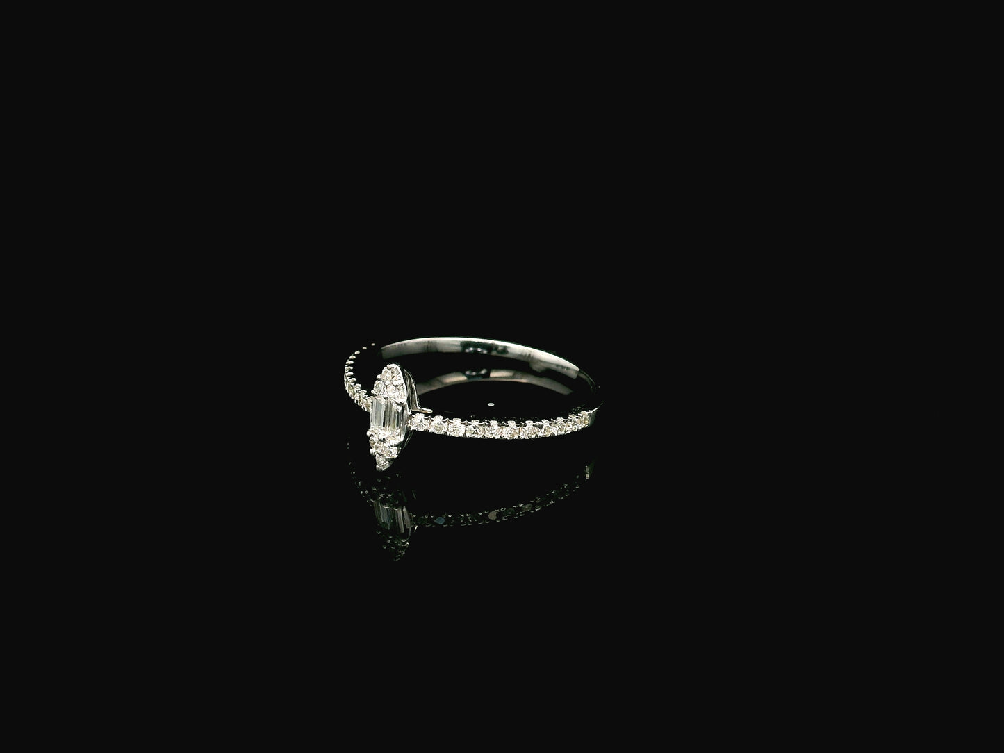 18K white gold marquise diamond ring featuring a combination of round brilliant and baguette diamonds with a total diamond weight of 0.28 carat.