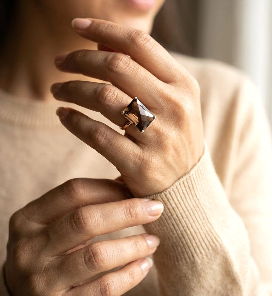 11.76 carat emerald cut smoky topaz ring in 18K rose gold solitaire setting by Emirates Diamonds