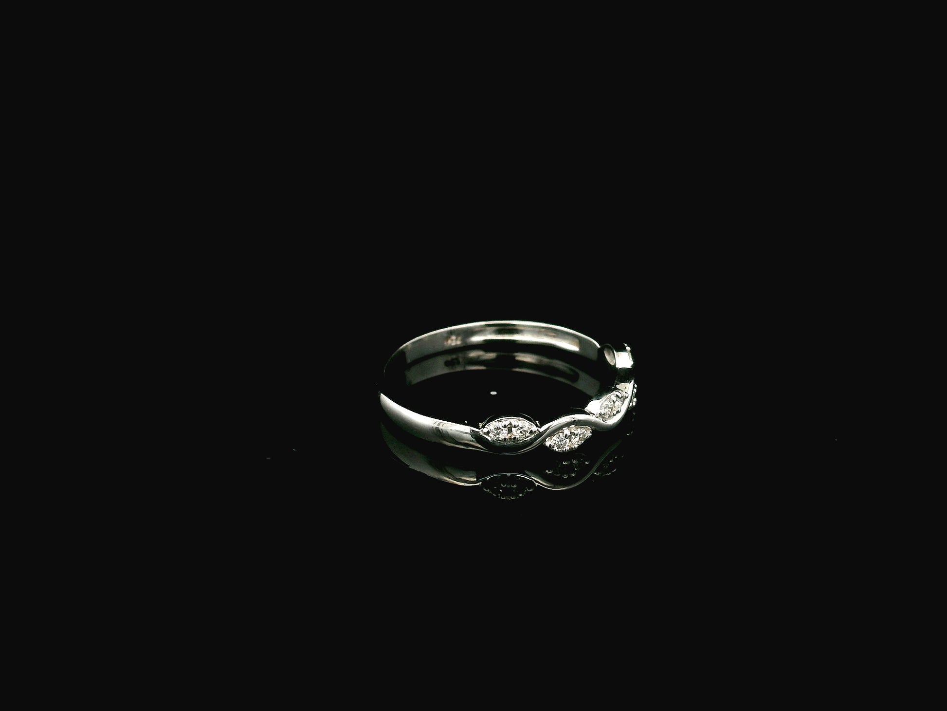 Diamond wave band ring in 18K white gold curved stacking ring design