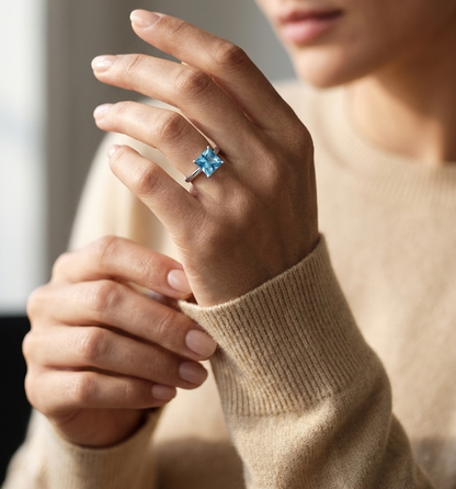 Square cut blue topaz solitaire ring in 18K white gold minimalist design
