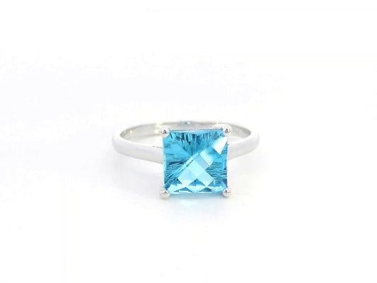 Square cut blue topaz solitaire ring in 18K white gold minimalist design