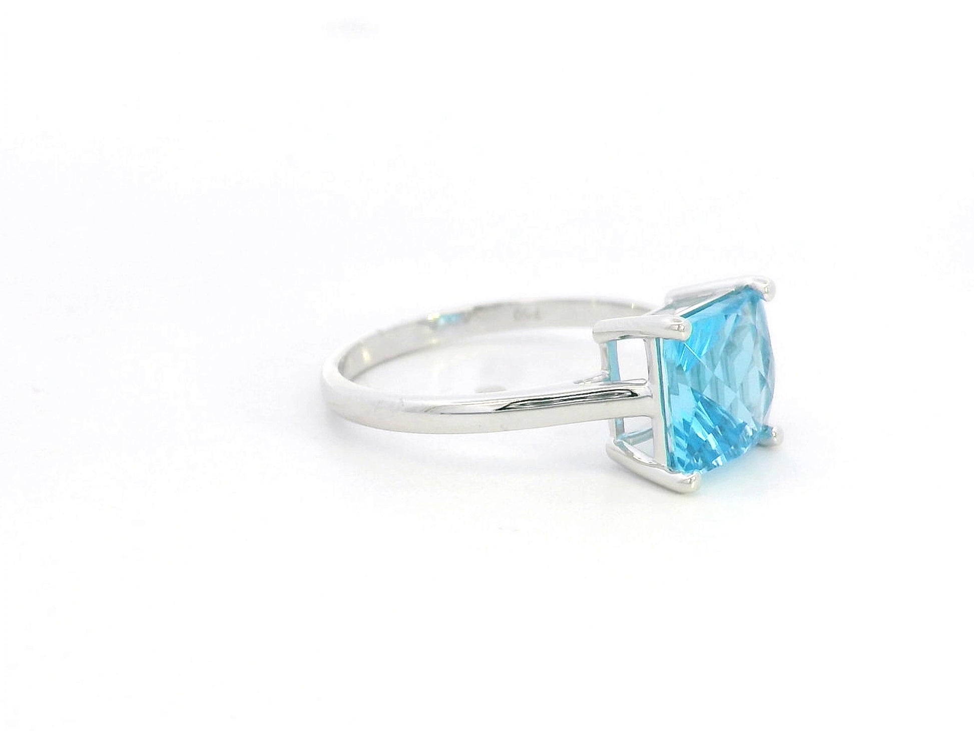 Square cut blue topaz solitaire ring in 18K white gold minimalist design