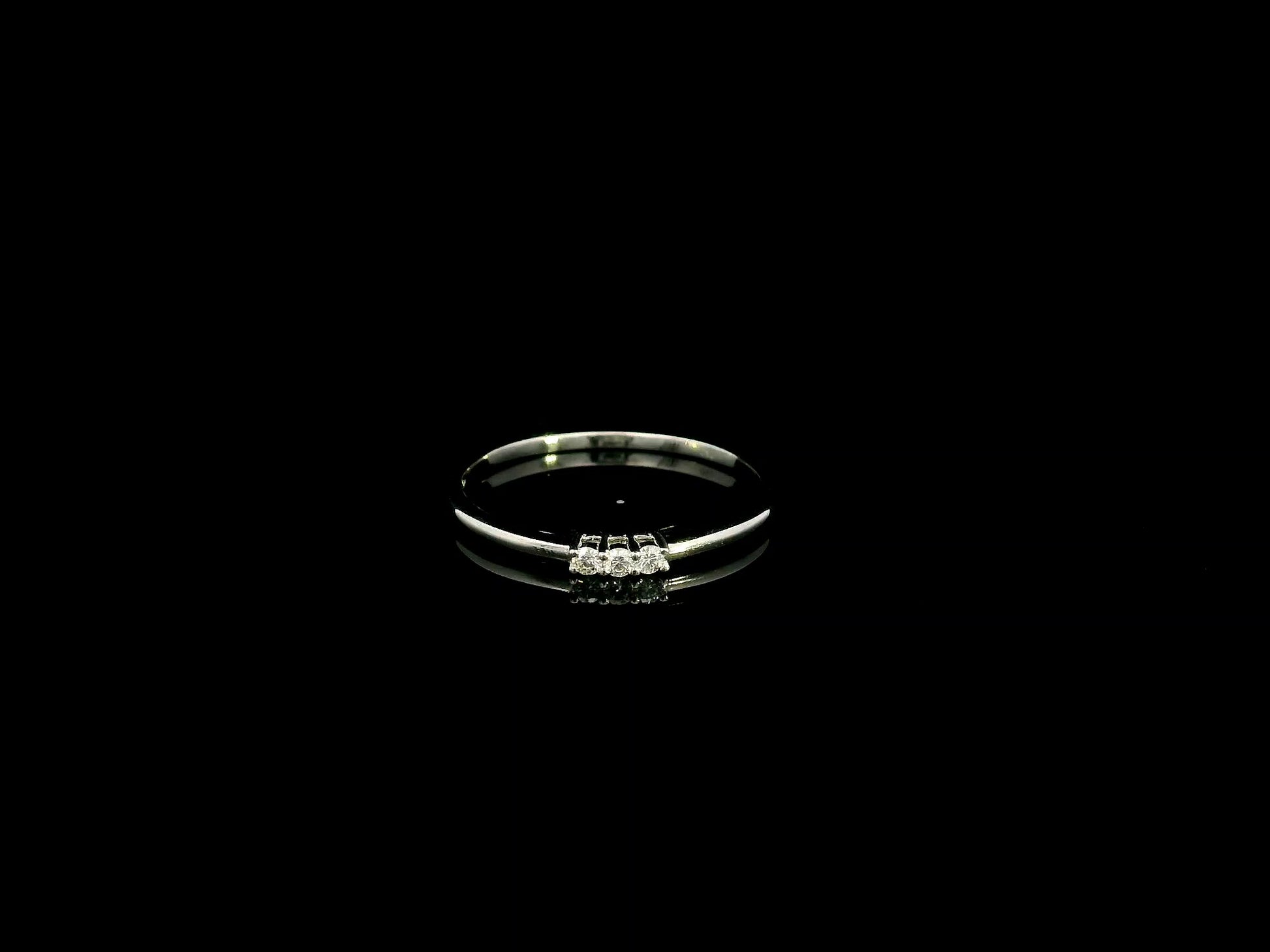18K white gold minimalist three diamond ring with slim polished band