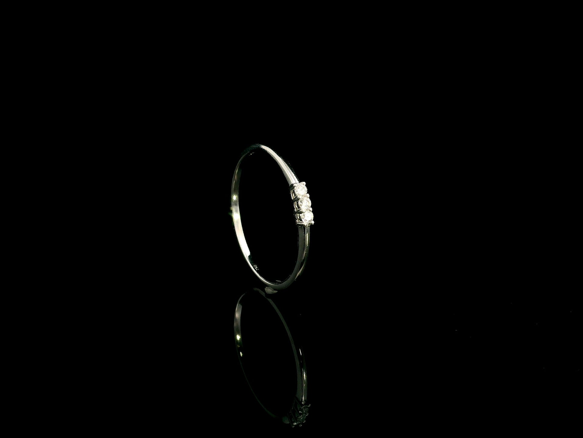 18K white gold minimalist three diamond ring with slim polished band