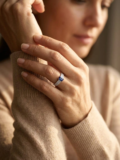 Emerald cut sapphire and diamond ring in 18K white gold