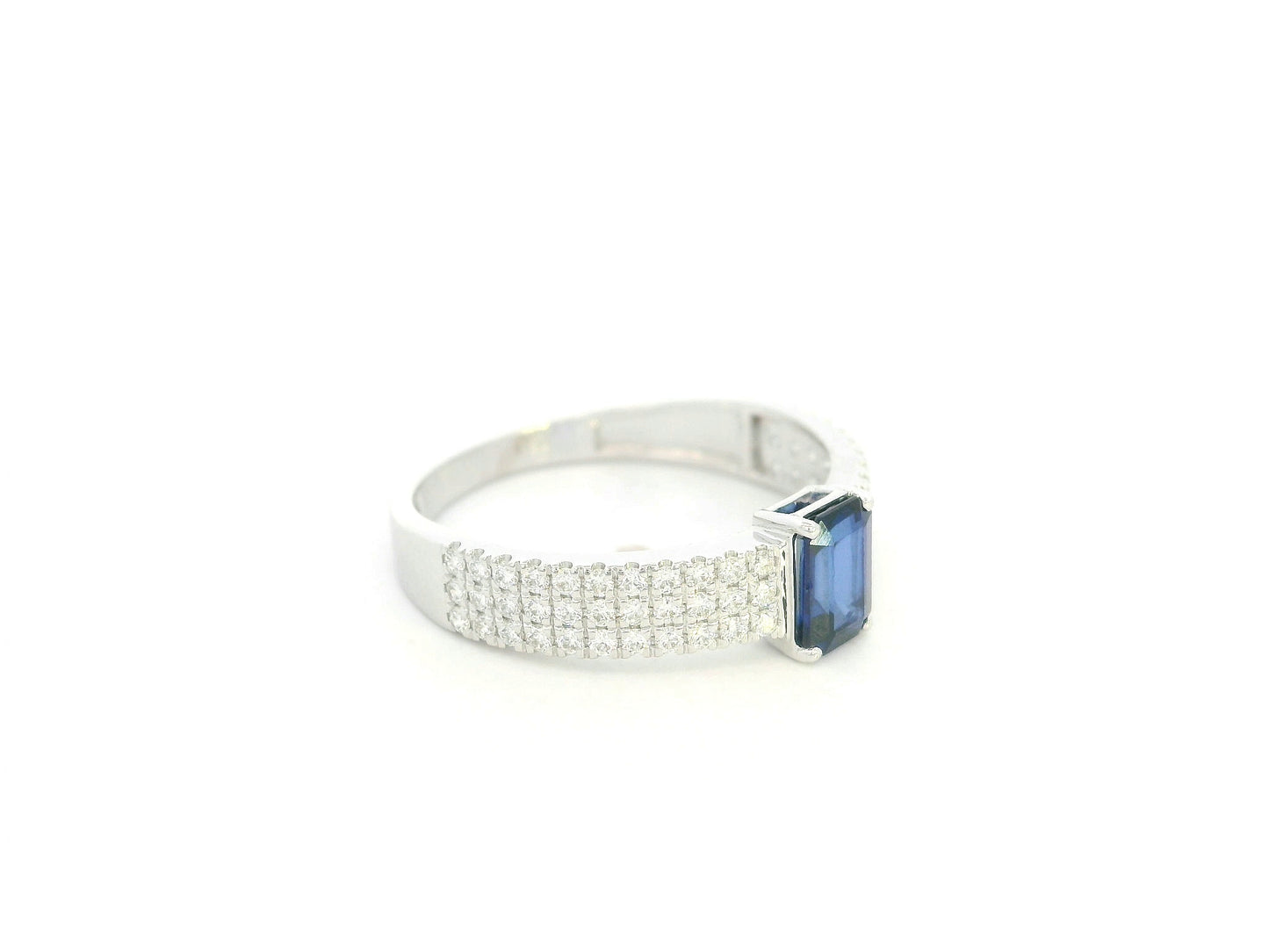Emerald cut sapphire and diamond ring in 18K white gold