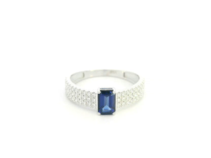Emerald cut sapphire and diamond ring in 18K white gold