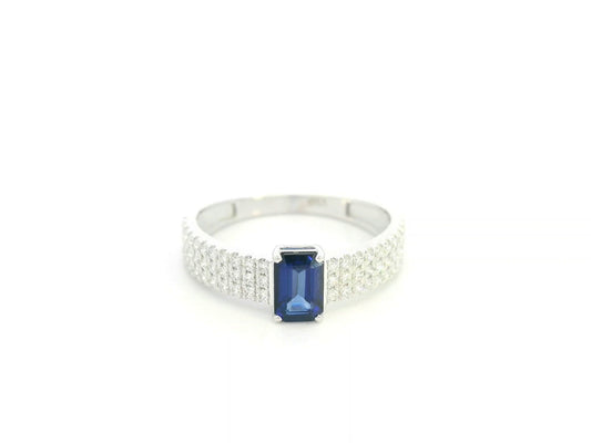 Emerald cut sapphire and diamond ring in 18K white gold