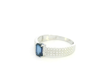 Emerald cut sapphire and diamond ring in 18K white gold