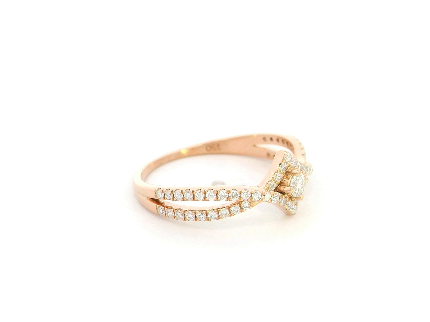 Diamond halo twist ring in 18K rose gold featuring 0.39 carat natural diamonds