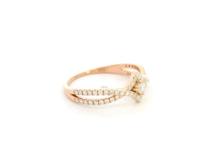 Diamond halo twist ring in 18K rose gold featuring 0.39 carat natural diamonds