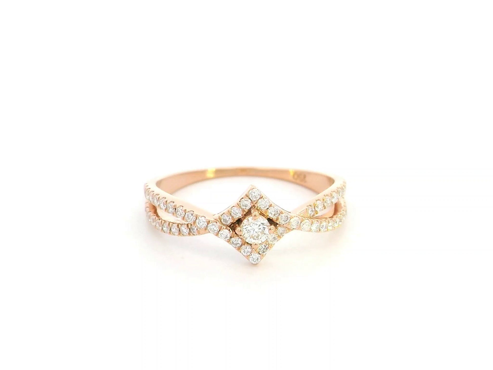 Diamond halo twist ring in 18K rose gold featuring 0.39 carat natural diamonds